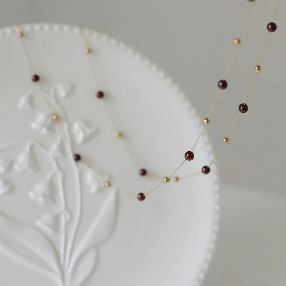 golden bead and garnet bead bracelet