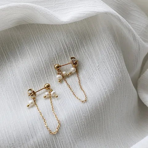 Naughty pearl fringe earrings
