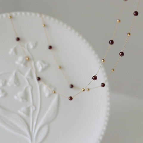 golden bead and garnet bead bracelet