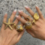 Model wearing waterproof stainless steel starfish shell ring